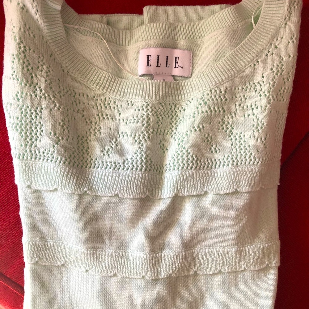 Size S, pale aqua sweater with beautiful details.